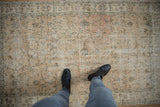 Distressed Sparta rug texture with faded spiral vines and mostly even wear.