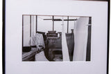 Framed black and white contemporary photograph depicting draped linens.