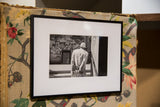 The Walk framed photograph shown at an angle, highlighting its black frame and white mat.