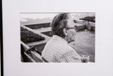 Framed black and white photograph 'The Chatter' of an older person with a cane.