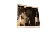 An angled view of the Trophies photograph, showing the physical print and its white border.