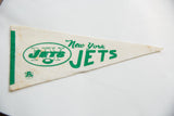 Aged cream felt vintage New York Jets pennant with bold green logo and stripe.