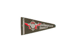 A dark felt vintage Los Angeles Angels pennant with a weathered red and white baseball logo.