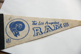 Blue ram head logo, NFL emblem, and 'The Los Angeles RAMS' text on felt pennant.