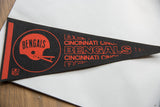 Orange Cincinnati Bengals helmet logo, team name, and NFL shield on black felt.
