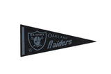 Vintage Oakland Raiders felt pennant, circa 1960s, black with silver logo and text, 5x12.