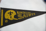 New Orleans Saints vintage felt pennant, gold team lettering on dark gray felt.