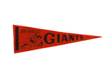 Vintage San Francisco Giants felt pennant with sliding baseball player graphic, orange and black, 1960s.