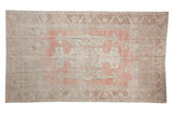 Vintage distressed Oushak rug with faded pink, blush, and bronze triple medallions, 4'11