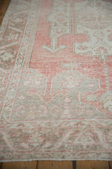 Distressed Oushak carpet pile detail, featuring even wear, soft pink, and earthen neutral motifs.