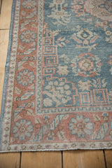 Distressed Sparta rug texture revealing worn knot heads and dusty blue, terracotta patterns.
