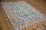 Distressed Turkish Sparta rug edge with dusty blue, pale terracotta border and original selvages.