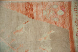 Vintage distressed Oushak rug with heavily abrashed beige and sun-faded tangerine pile.