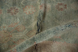Abrashed texture and sun-faded sea foam green pile on a vintage Oushak rug.