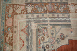 Distressed Oushak carpet corner featuring floral spandrel and vine palmette border.