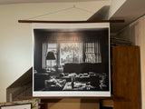 Angled view of The View black and white print in a wood poster hanger.