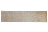 Distressed vintage Karaja runner, hand-knotted, geometric medallions, faded pink, ivory, dusty green.
