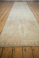 Faded pale pink Karaja runner with distressed texture and geometric designs.