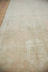 Distressed vintage Karaja runner showing faded pale pink, ivory, and sand geometric patterns.