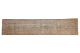 Vintage distressed Karaja runner with faded blush and sand tones, geometric center medallion, 2'8