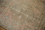 Distressed vintage Karaja rug pile, pale blush, sand, and blue hook and latch patterns.