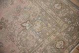 Vintage distressed Tabriz carpet corner with vine and arabesque spandrel in pale pink and slate blue.