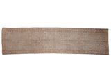 Vintage Sivas runner with distressed lotus palmettes and millefleur in soft pink, beige, and silver tones.