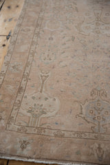 Even wear across the knot heads of a vintage Sivas runner with muted floral details.
