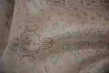 Low pile of a distressed Sivas rug showing even wear to the knot heads and faint foundation.