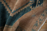 Distressed vintage Hamadan rug pile texture in camel brown and dusty turquoise.