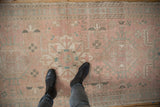 Vintage distressed Karaja runner: pink, blue geometric medallions, floral motifs, even worn texture.