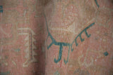 Distressed vintage Karaja runner pile with even wear, faint foundation, pink, and dusty teal.