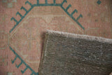 Close-up of distressed Karaja rug pile, even wear, visible woven foundation and fringe.