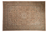 Distressed vintage Tabriz carpet, dusty rose and beige geometric floral medallion.