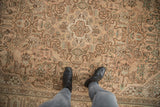 Distressed vintage Tabriz carpet texture with even wear, geometric dusty rose and mint patterns.