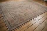Distressed vintage Tabriz carpet with Herati design motif on beige, dusty rose, and jade spandrel.