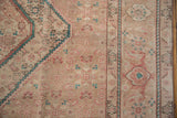 Distressed vintage Tabriz rug, corner Herati pattern in beige, dusty rose, emerald green.