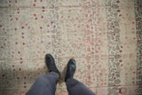Distressed Sivas rug with abrashed field, faded vinery, and even wear to knot heads.