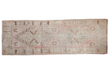 Vintage Distressed Oushak runner, pink and ivory with faded medallion floral motifs, measuring 3'9