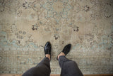 Distressed vintage Tabriz carpet, mostly even wear, ivory, powder blue, and charcoal motifs.