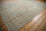 Distressed vintage Tabriz carpet section, ivory, powder blue motifs; faint foundation showing.