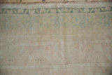 Intact original side cord selvage and soft, textural pile of a distressed Oushak carpet.