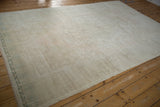 High luster and polished sheen across the soft pile of a distressed vintage Oushak carpet.
