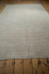 High luster and polished sheen on the soft, distressed pile of a vintage Oushak rug.