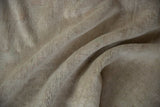 Reverse side of a vintage Oushak carpet showing its hand-knotted foundation and tight weave.