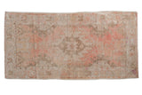 Vintage Distressed Oushak runner, serrated medallion design, faded pink and ivory with even wear.