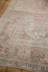 Distressed Tabriz corner spandrel with scrolling arabesques, dusty rose, and coffee brown.