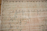 Decorative distressed Oushak rug, with worn pile in pale pink, seafoam green, ivory.