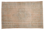 Distressed Oushak carpet with muted roundel medallion, dusty blush and teal floral patterns, 6'3