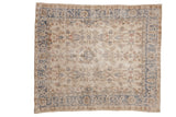 Distressed Turkish Sparta square rug with ivory field, faded slate blue border, floral motifs.